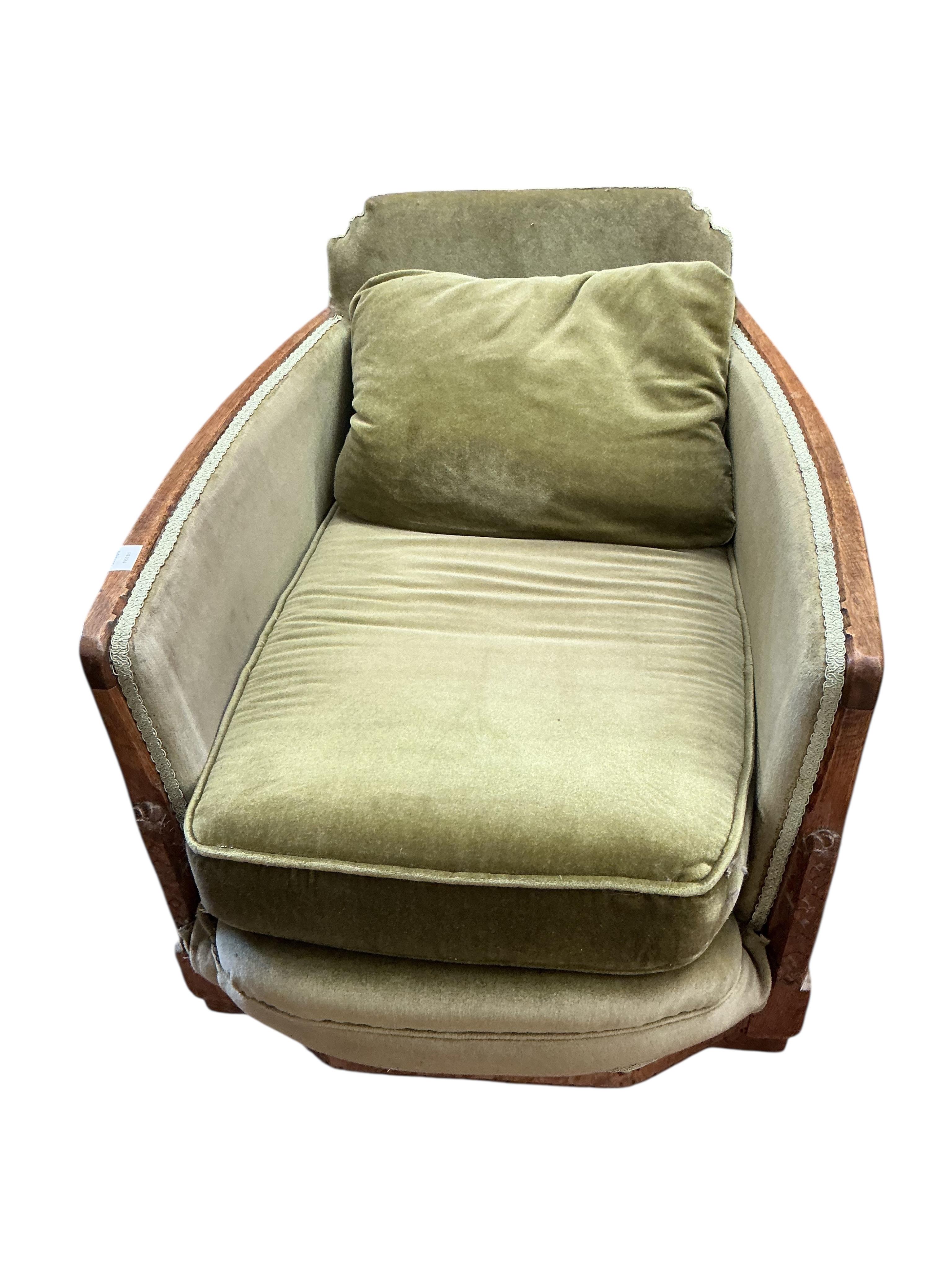 A pair of French Art Deco oak armchairs, width 69cm, depth 90cm, height 69cm